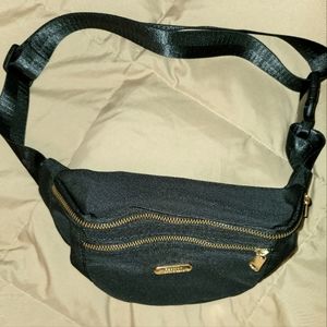 Black belt bag with gold zippers